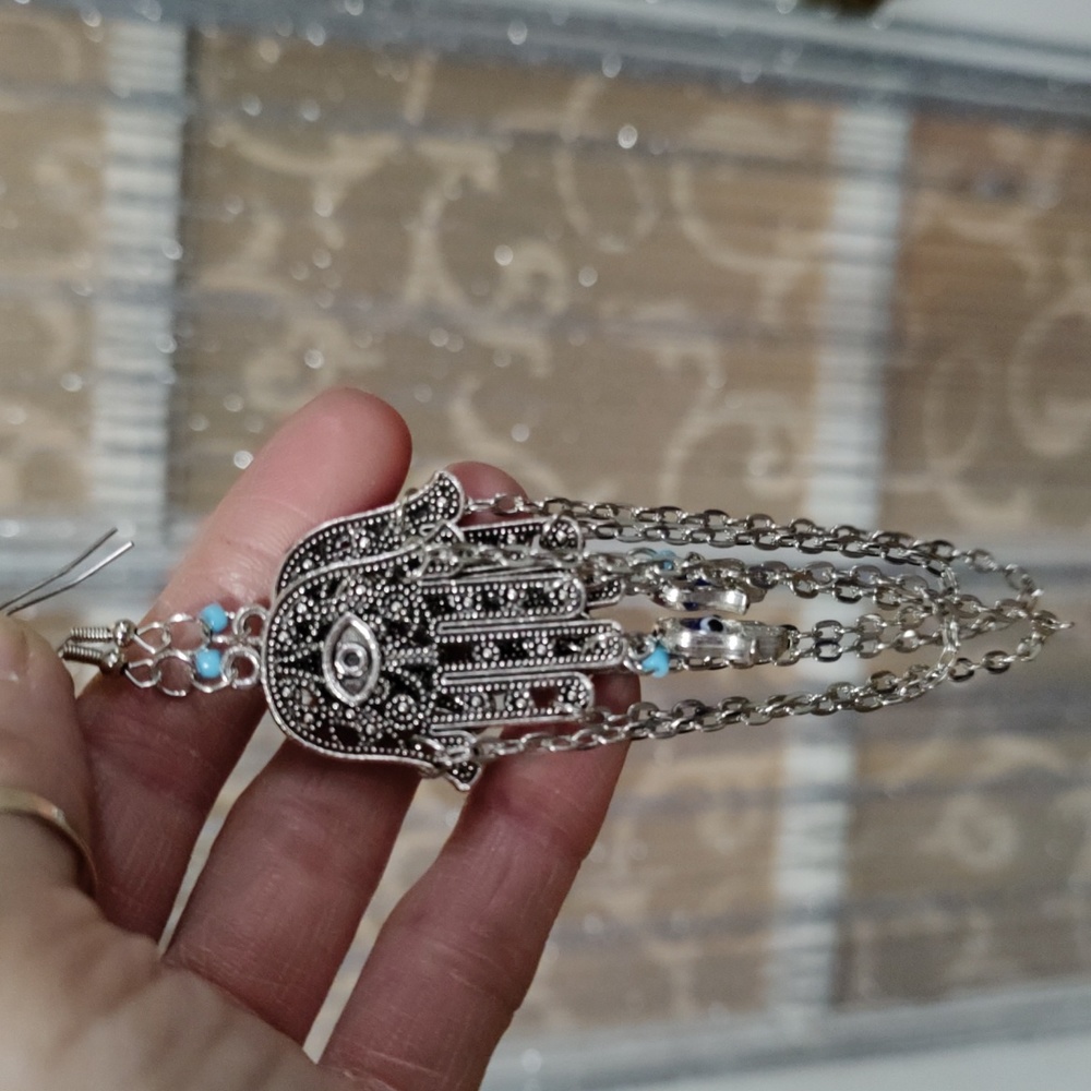 Hamsa Hand earrings with a turquoise bead